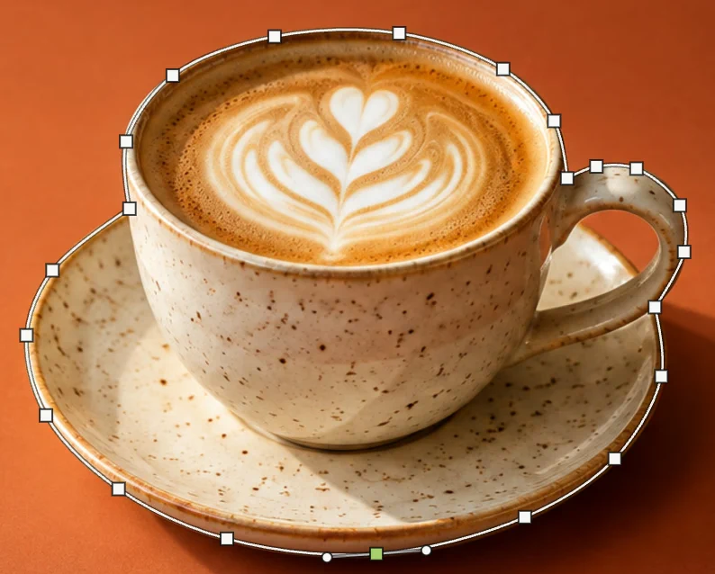 La tazza e il piattino con un tracciato sottile intorno: punti quadrati lungo l’orlo, il manico e il bordo del piattino, un punto selezionato in verde