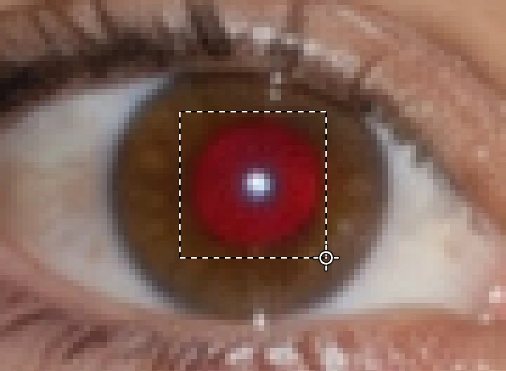 Una pupilla rossa ingrandita con il rettangolo tratteggiato dello strumento aderente al disco rosso