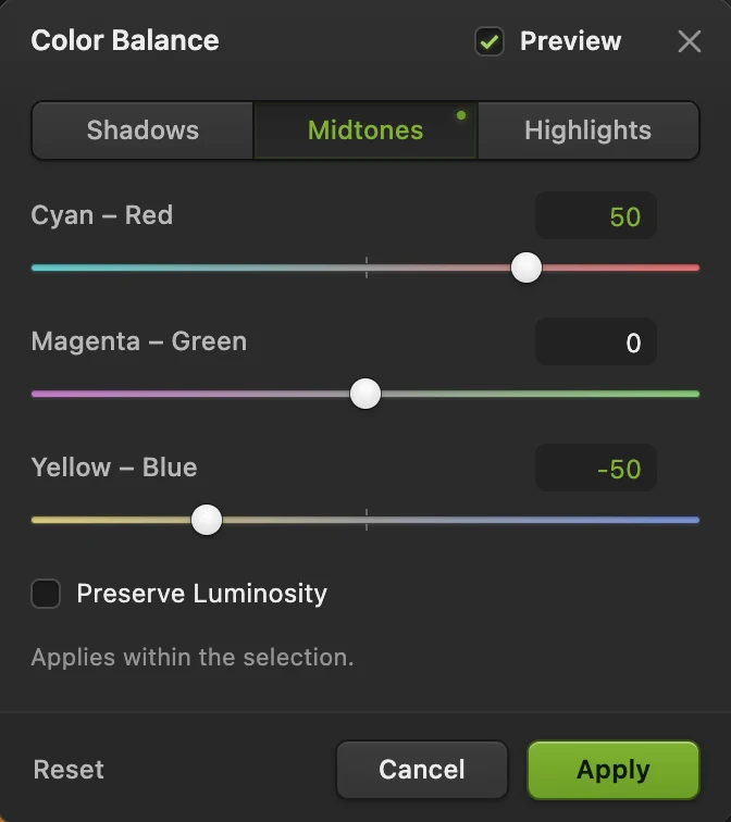 La finestra Bilanciamento colore su Mezzitoni con Ciano – Rosso 50, Magenta – Verde 0 e Giallo – Blu −50, con la nota che si applica all’interno della selezione